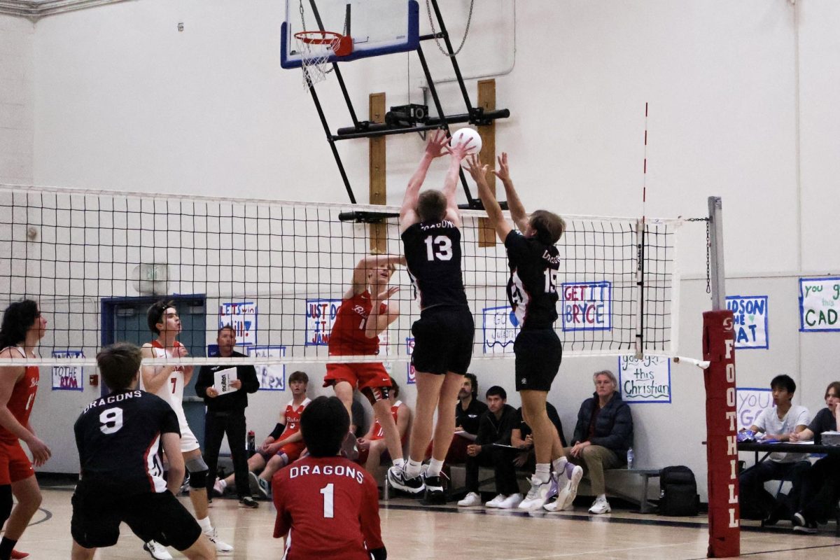 Curren Wiggins '26 (number 13) and Elijah Haigh '25 (number 15) leap to block a spike from Bishop Diego High School (Bishop Diego) during their volleyball match. Despite the block, Foothill Technology High School (Foothill Tech) couldn’t secure a win, losing 0-3. The team played with heart and intensity, refusing to back down. While Bishop Diego's offense triumphed, Foothill Tech’s defense showed resilience and determination throughout the game.