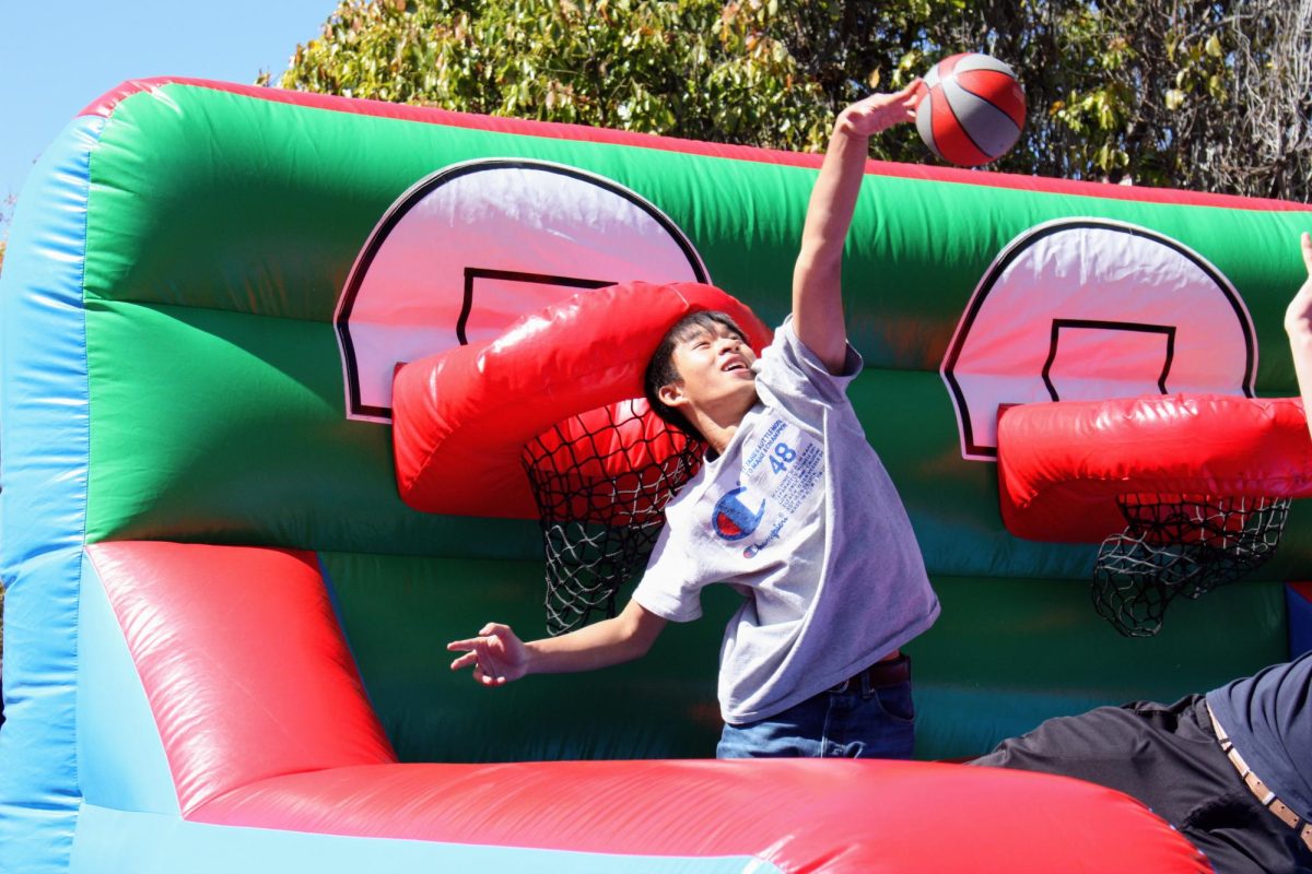 On the sunny afternoon of March 7, 2025, students took turns competing to see who could sink the first basket on the inflatable basketball court during Foothill Technology High School's (Foothill Tech) final Renaissance Rally. With a Spirit Week helping students get in-theme for the Rally, the events and festivities are designed to reward students with their academic achievement so far in the school year. This energetic match up drew a crowd of people cheering for both individuals and became a standout moment for Foothill Tech's organized event.