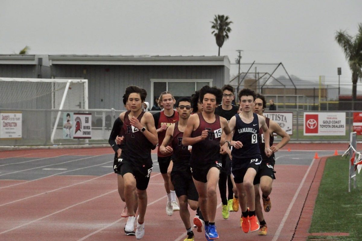 Foothill Technology freshman Beau Anderson (number 2) and Yannick Colin (number 15) lead out their 800m heat in a strong line.