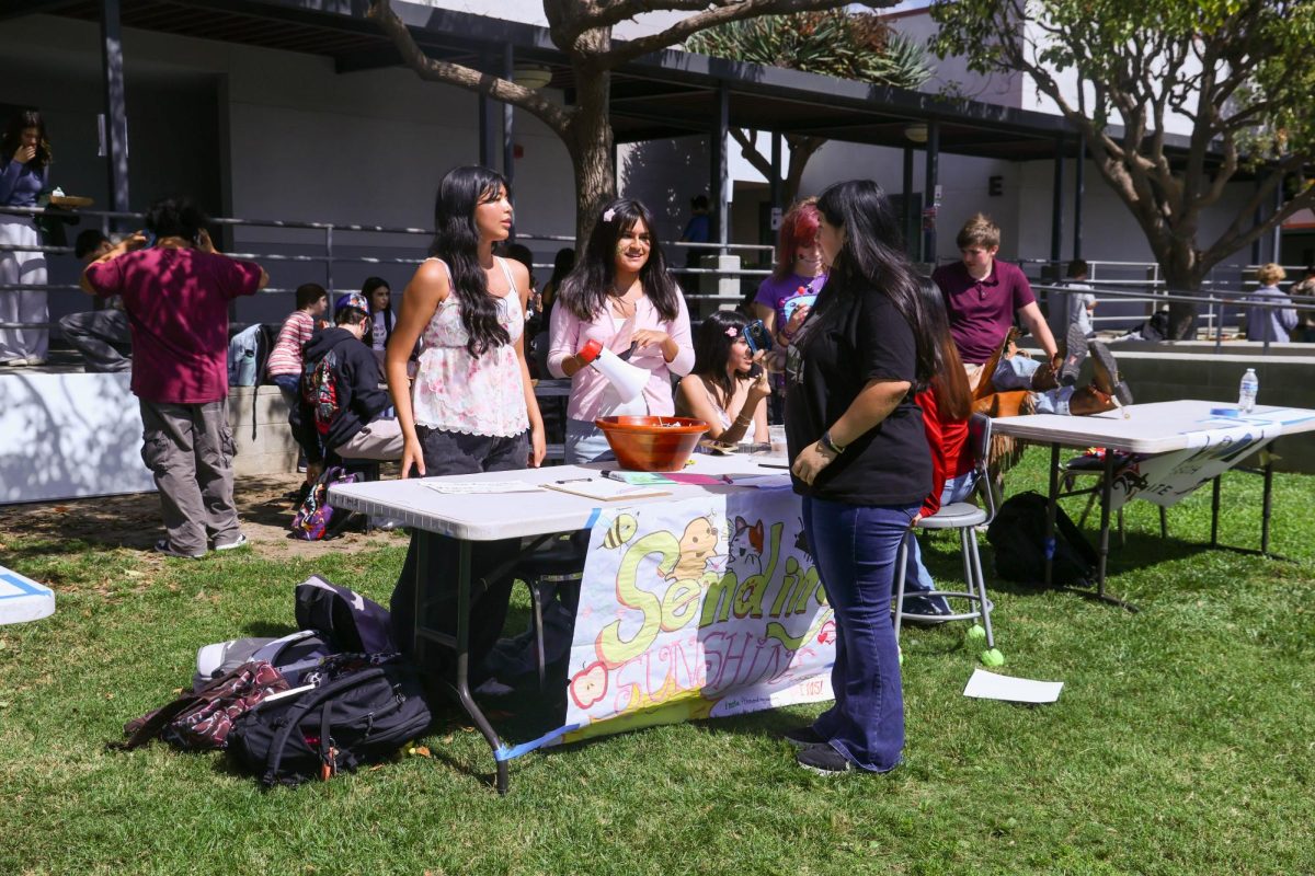Members of the Sending Sunshine club were one of the many groups seen at Club Rush, held on Oct. 1, 2025. They talked with students interested in joining their effort to give joy to senior citizens through handwritten letters, demonstrating the purpose of club rush: to let students know about the different clubs that take place at Foothill Technology High School (Foothill Tech) and inform the students about the purpose of the club.