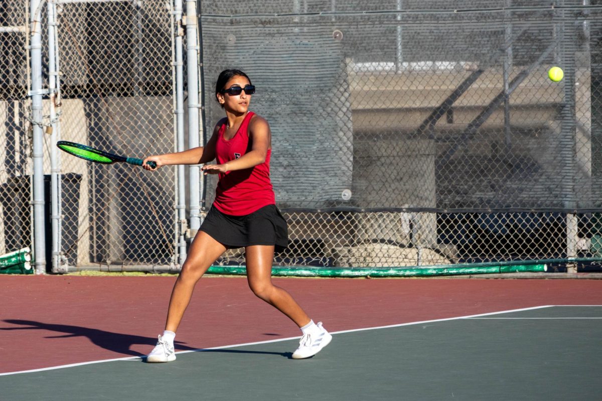 The sun was beaming and the winds were soaring on Thursday, Oct. 9, when Foothill Tech’s girls varsity tennis team took to Ventura College’s courts with two goals: to slam down their opponents from St. Bonaventure High School and to celebrate their senior players. Team captain Saanvi Joshi ‘26, Violet Polley ‘26, Aarna Khanavkar ‘26 and Diana Hixon ‘26 were honored through creative posters handmade by fellow teammates, while friends and family gathered to witness one of the last matches of their high school tennis careers. Joshi, pictured above, drives home a winning point.