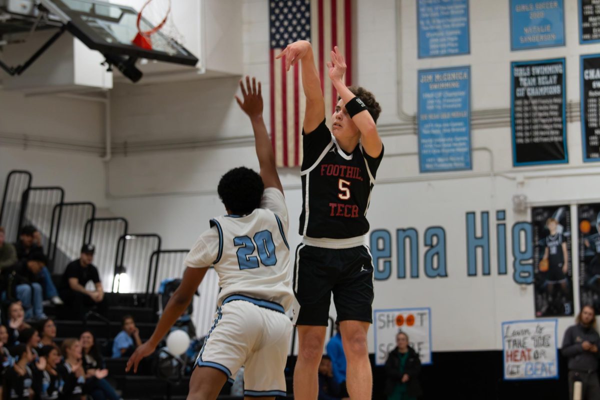 Nick Turner '26 (Number 5) is one of Foothill Tech boys basketball's shooting guard and point guard. Here Turner is playing against Buena High School, seen taking consistent shots. Turner has displayed his skills over the season's as he is a fourth year varsity player. Turner is known for his fast offense and strong performance's on the court which has made him a very important part of the team.Turner helps his team not only with his skills but his leadership to help set a tone for their games, constantly showing his unwavering work on the court.