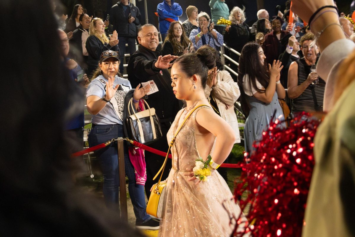 On Friday, March 13, Mission Church presented its free prom for students with disabilities, A Night to Remember. Guests strut down the red carpet and are greeted by the flashing lights of cameras held by paparazzi.