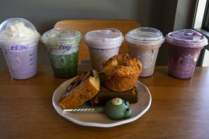 Starbucks’ 2026 spring menu consists of varied foods and drinks, ranging from lavender to coconut and yuzu citrus cream to vanilla cake. Writers Liz Geib and Trudy Ragsdale reviewed the new offerings, tasting each item and providing honest feedback on flavor, texture, and presentation. Trudy Ragsdale noted the visual-to-taste comparison: “While the majority are visually appealing, some products didn’t live up to the expectations set by their appearance.”
