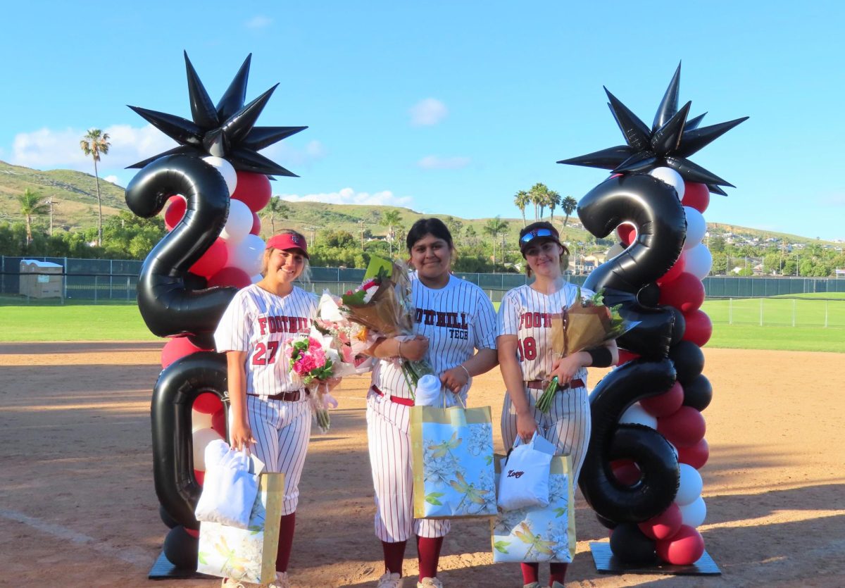 On April 21, the Foothill Technology High School softball team celebrated their seniors Jaylee Espinoza (left) Natali Rodriguez (center) and Zoey Watkins (right) with a quick 11-0 win in five innings. The seniors' families gathered for a post-game ceremony. Each girl received flowers and a specialized gift bag from the team, thanking them for their dedication to the program.