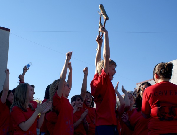 Junior Aron Egelko holds "The Golden Crutch" in victory after Cohort 6 won the BioScience Olympics. Maya Morales/The Foothill Dragon Press.