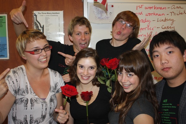 Speech & Debate members Aron Egelko, Karen Fox, Colin Crilly, Molly Roberts and Trenton Pham crowd around senior Brittany Bernardi (far left) during a club meeting. Portrait Credit: Gemma Stoll/The Foothill Dragon Press.