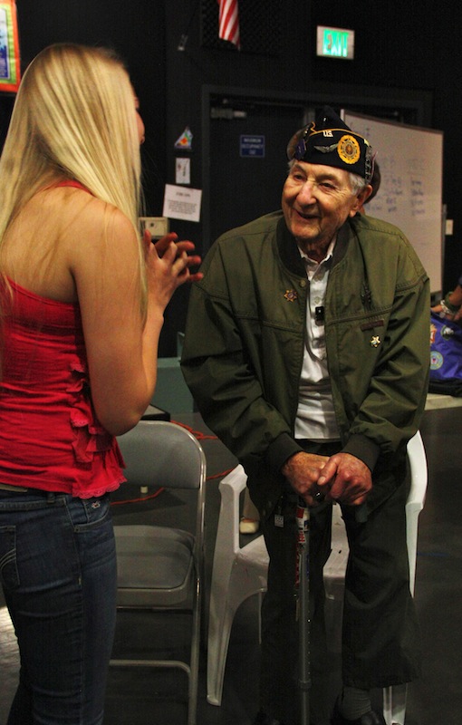 Holocaust survivor Bernd Simon talks with sophomore Anna Cogswell. Credit: Aysen Tan/The Foothill Dragon Press