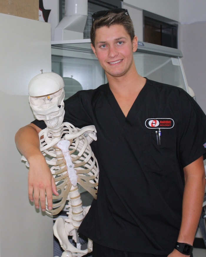 Junior Henry Ashworth poses for a shot after job shadowing. Credit: Emma Huebner/The Foothill Dragon Press.