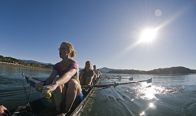 Student crew team members enjoy some sun while rowing on Lake Casitas, which held the 1984 Olympic rowing and kayaking events. Photo courtesy of Rich Reid.·