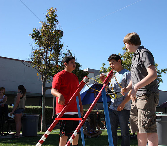 Sophomores Saad Fakhouri, Christian Alamillo, and Tanner Woodward launch their catapult for conceptual physics. Credit: Emilie Ghafouri/The Foothill Dragon Press.