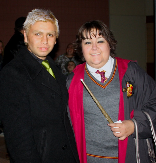 Harry Potter fans Horacio Sanchez and Laura Harris pose in their Potter-themed costumes outside of the Harry Potter and the Deathly Hallows midnight showing. Credit: Geneva Douma/The Foothill Dragon Press.