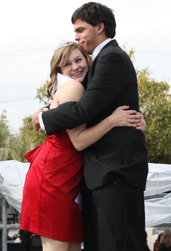 Seniors Alexandra Zinik and David White share a hug before the Winter Formal Expo began Friday. Credit: Jocelyn Rodriguez/The Foothill Dragon Press.