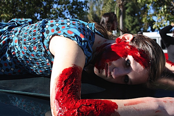 Senior Gabby Trainor acts as a dead victim of a drunk driving accident during the simulation "Every 15 Minutes" yesterday. Credit: Rachel Crane/The Foothill Dragon Press.