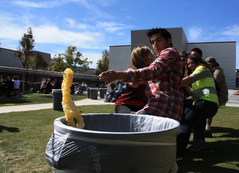 Senior Alex Villalpando participates in the tug-of-war competition on Tuesday. Credit: Aysen Tan/The Foothill Dragon Press