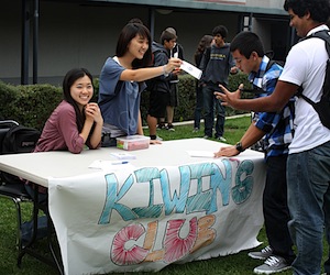 KIWINs president Sharon Choi hands out flyers to promote the new club during Club Rush. Karie Portillo/The Foothill Dragon Press.