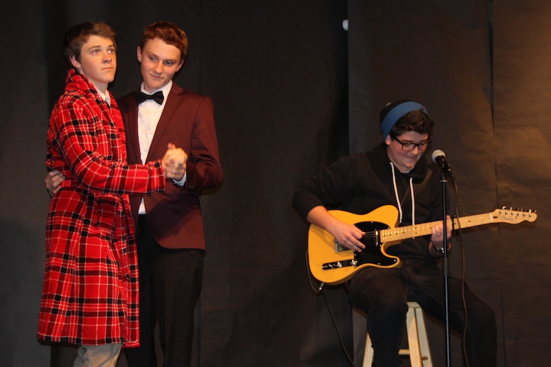 Juniors Nate Rowley and Jackson Tovar dance while junior Steven Mariani plays the guitar. All three competed in last night's Mr. Foothill competition. Credit: Felicia Perez/The Foothill Dragon Press.