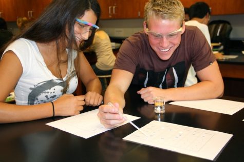 Sophomores Ariana Singer and Andrew Miech work on a lab for chemistry. Credit: Bethany Fankhauser/The Foothill Dragon Press