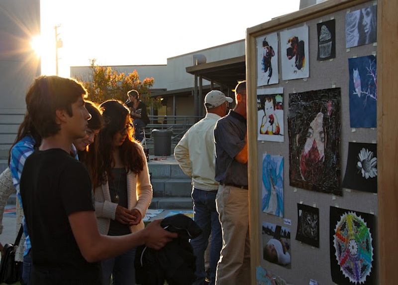 Foothill sophomores Angel Mayorga (far left), Victoria Bonds (second from left), and Sarah Reyes (far right) stand with Ventura sophomore Tess Tait (second from right) and look at the pieces submitted to Foothills annual art show. Credit: Anaika Miller/The Foothill Dragon Press