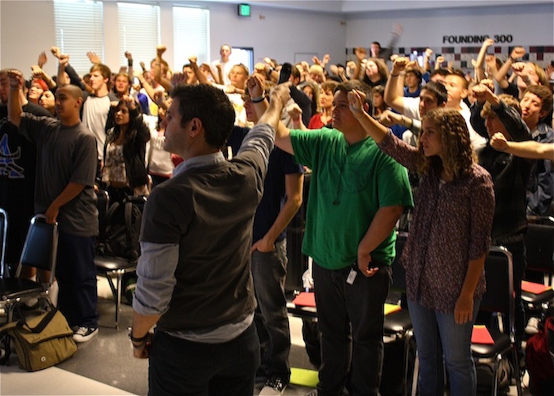 Art teacher Justin Frazier leads the Class of 2012 in a pledge to "finish strong" at the Hero Project launch in September. They will be the last Foothill class to participate in the Hero Project because staff members recently decided to change the project. Credit: Jillian Lopez/The Foothill Dragon Press