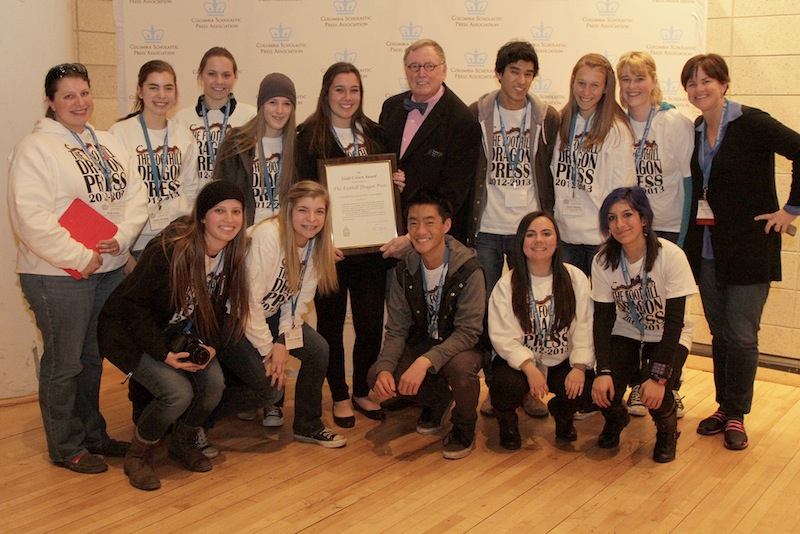 12 members of The Foothill Dragon Press staff and two advisers accepted the Gold Crown Award at Columbia University last Friday. From left, adviser Kelly Savio, juniors Emily Chacon, Glenda Marshall, Katie Sones, Melissa Marshall, Bridget Parrino, Allison Clark, CSPA Chair of Committee on Judging Practices C. Bruce Watterson, juniors Aysen Tan, Michael Morales, Veronica Mellring, Megan Kearney, sophomore Canela Lopez, junior Karina Schink, and adviser Melissa Wantz. Credit: CSPA Assistant Director Rebecca Castillo/The Foothill Dragon Press