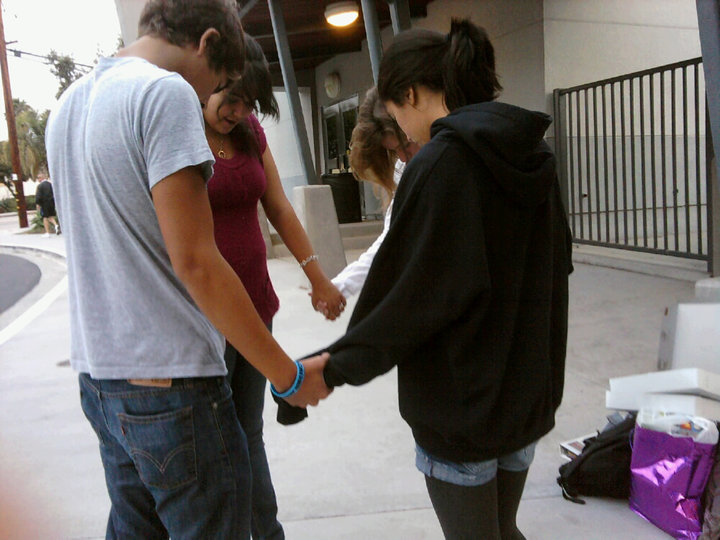 Participants in See You At the Pole join hands at Foothill to pray. Photo by Caitlin Trude of The Foothill Dragon Press.